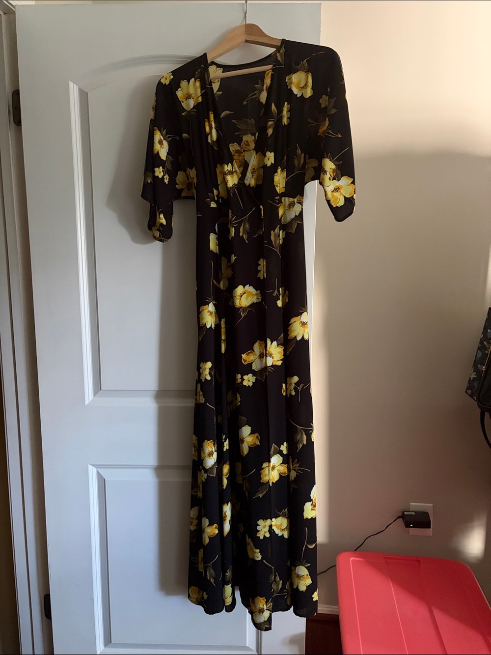 Elegant Black Faux Wrap Dress with Yellow Floral Print and Belt